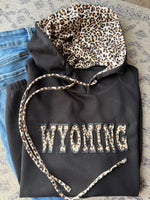 Embroidered Wyoming Jet Stream Leopard Contrast Drawstring Hood Drop Shoulder Loose Top