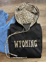 Embroidered Wyoming Jet Stream Leopard Contrast Drawstring Hood Drop Shoulder Loose Top
